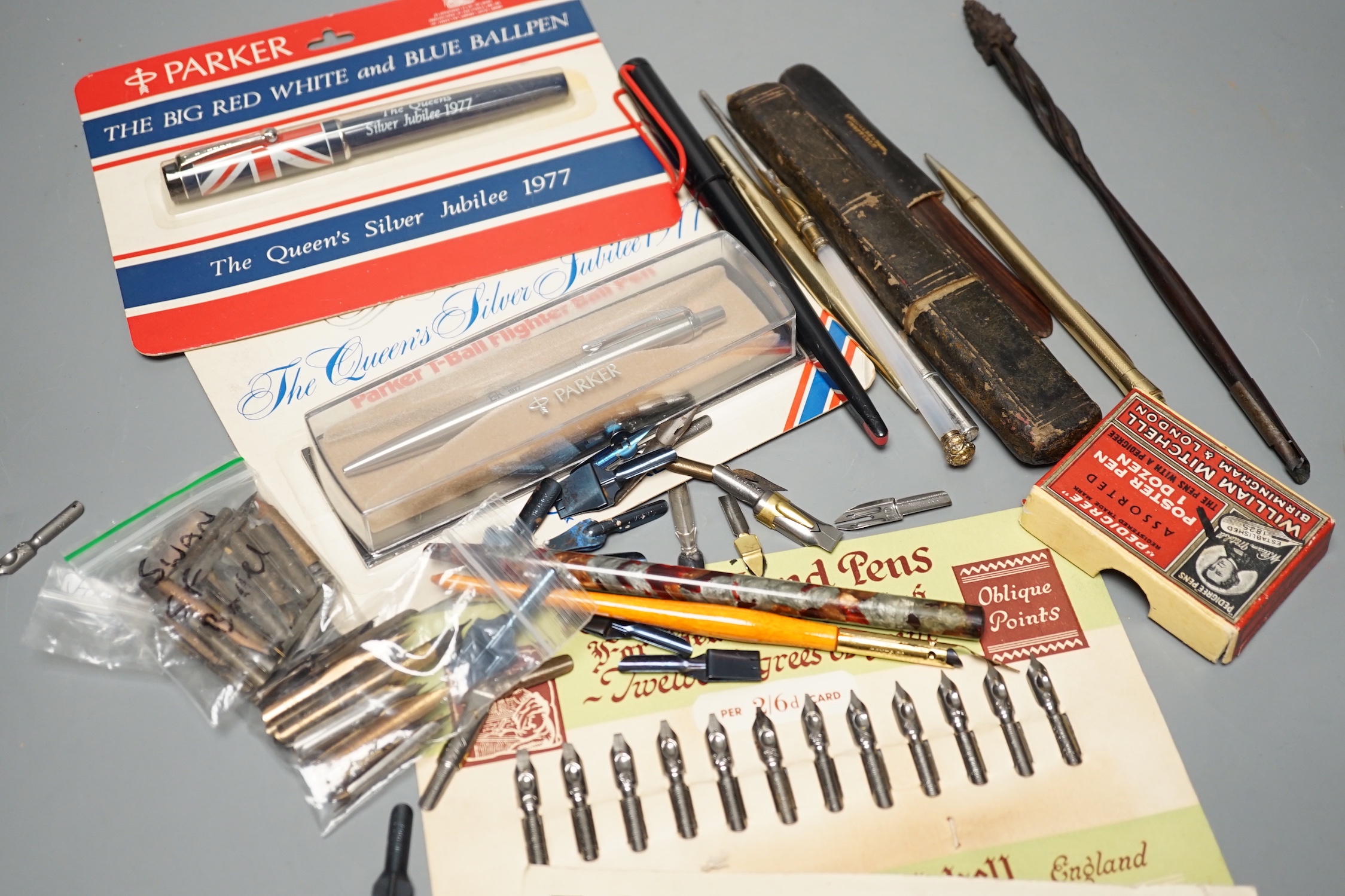A silver Tiffany dip pen, assorted writing equipment and quill knives
